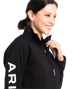 Woman wearing a black jacket with 'ARI' branding on a white background