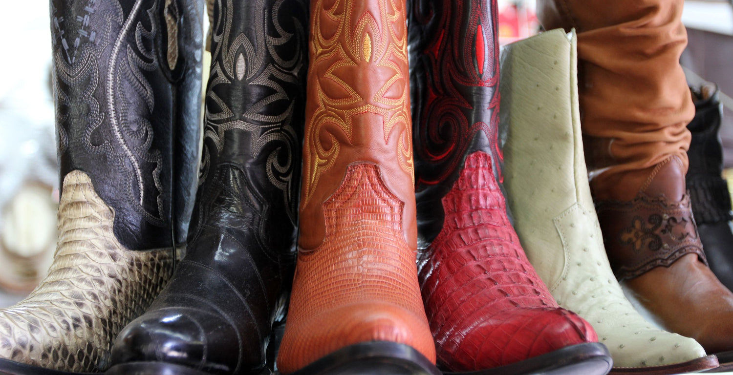 Collection of various cowboy boots in different colors and designs.